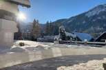 Experience the charm of winter in this stunning property! Nestled amidst a snowy landscape, this home offers breathtaking views of snow-covered mountains and lush evergreen trees.