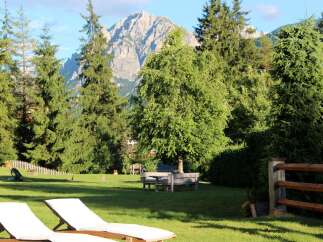 Escape to this stunning property surrounded by lush greenery and breathtaking mountain views.