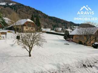Discover a charming property nestled in a serene winter landscape.