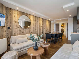 Experience luxury living in this stunning property, featuring a beautifully designed interior with a modern kitchen and a cozy living area.