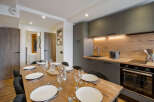 This stunning property boasts a modern kitchen and dining area, perfect for entertaining.