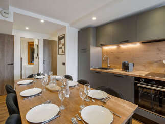 This stunning property boasts a modern kitchen and dining area, perfect for entertaining.