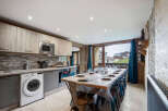 This stunning kitchen and dining area is the perfect space for entertaining.