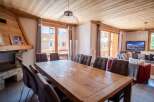 Experience luxury living in this stunning property, featuring a spacious dining area perfect for entertaining.