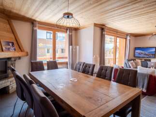 Experience luxury living in this stunning property, featuring a spacious dining area perfect for entertaining.