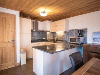 This stunning kitchen boasts a modern design with a touch of rustic charm.