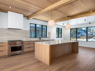 This stunning kitchen boasts a modern design with high-end finishes.