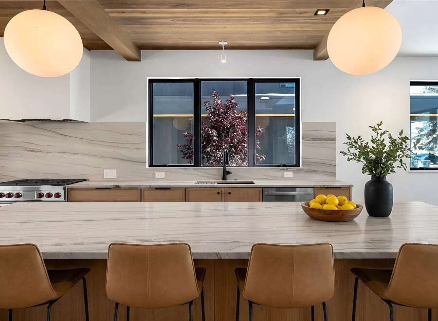 This stunning kitchen boasts a modern design with high-end finishes.