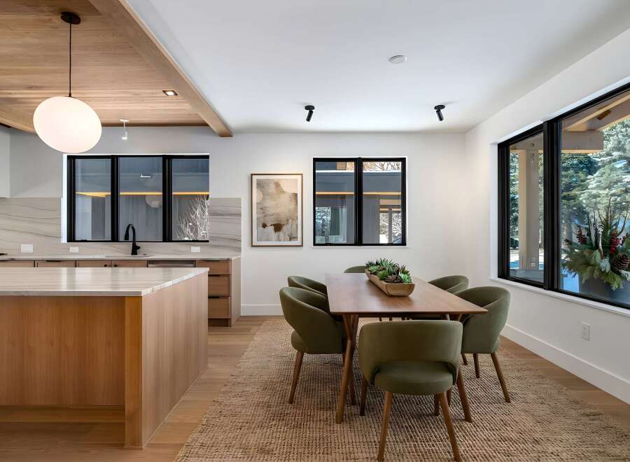 This stunning property boasts a modern kitchen with sleek countertops and ample storage, perfect for culinary enthusiasts.