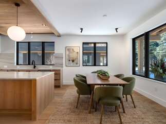 This stunning property boasts a modern kitchen with sleek countertops and ample storage, perfect for culinary enthusiasts.