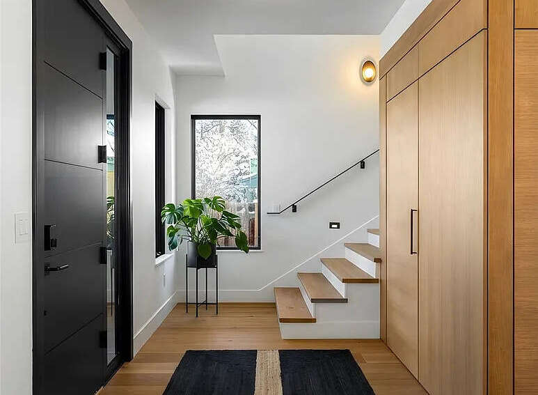 Step into a world of modern elegance with this stunning entryway.