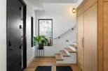 Step into a world of modern elegance with this stunning entryway.