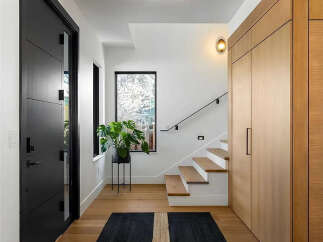 Step into a world of modern elegance with this stunning entryway.