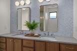 This stunning bathroom boasts a modern design with a touch of nature.