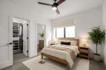 Step into this bright and airy bedroom, featuring a modern design with clean lines and neutral tones.