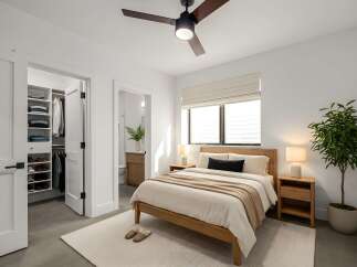 Step into this bright and airy bedroom, featuring a modern design with clean lines and neutral tones.