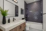 Step into a modern oasis with this stunning bathroom design.