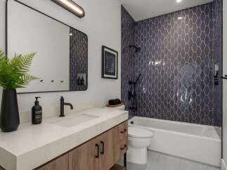 Step into a modern oasis with this stunning bathroom design.