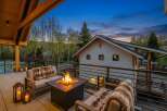 Enjoy the ultimate outdoor living experience with this stunning property! Featuring a cozy fire pit, comfortable seating, and a beautiful view, this space is perfect for entertaining or relaxing.