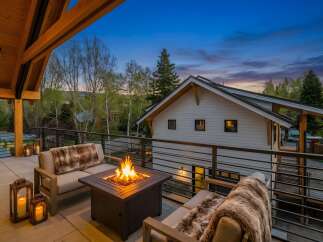 Enjoy the ultimate outdoor living experience with this stunning property! Featuring a cozy fire pit, comfortable seating, and a beautiful view, this space is perfect for entertaining or relaxing.