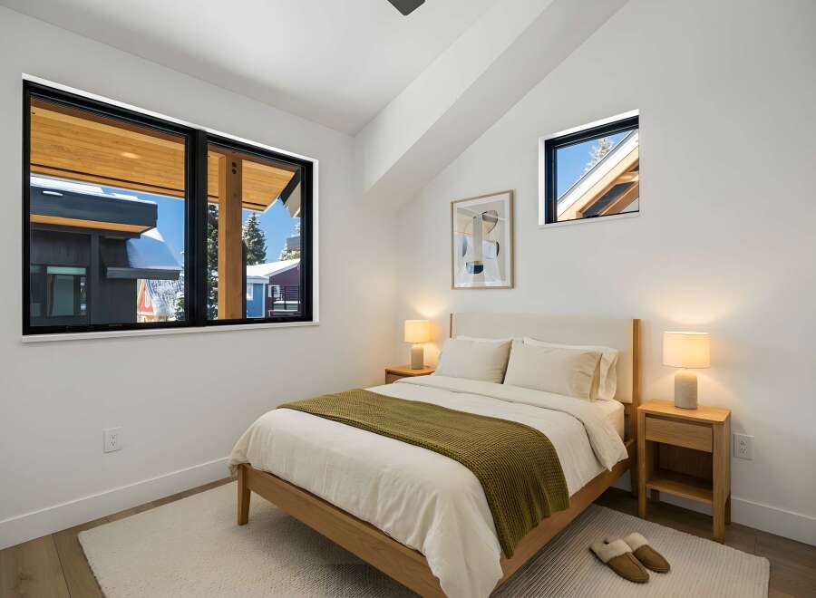 This cozy bedroom features a modern design with a touch of warmth.