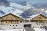 Experience the epitome of alpine living in this stunning property nestled amidst a breathtaking snowy mountain landscape.