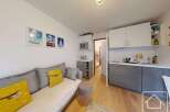 Discover this charming property featuring a cozy living area with a comfortable sofa and decorative pillows.