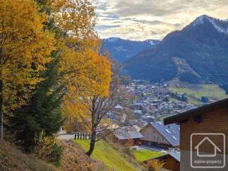 Discover your dream home in the heart of the mountains! This stunning property boasts breathtaking views of the surrounding landscape, with a charming village nestled below.