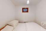 This cozy bedroom features a comfortable bed, perfect for a relaxing stay.