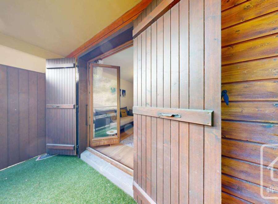 Discover the charm of this property, featuring stunning wooden doors and a welcoming entrance.