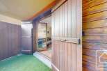 Discover the charm of this property, featuring stunning wooden doors and a welcoming entrance.