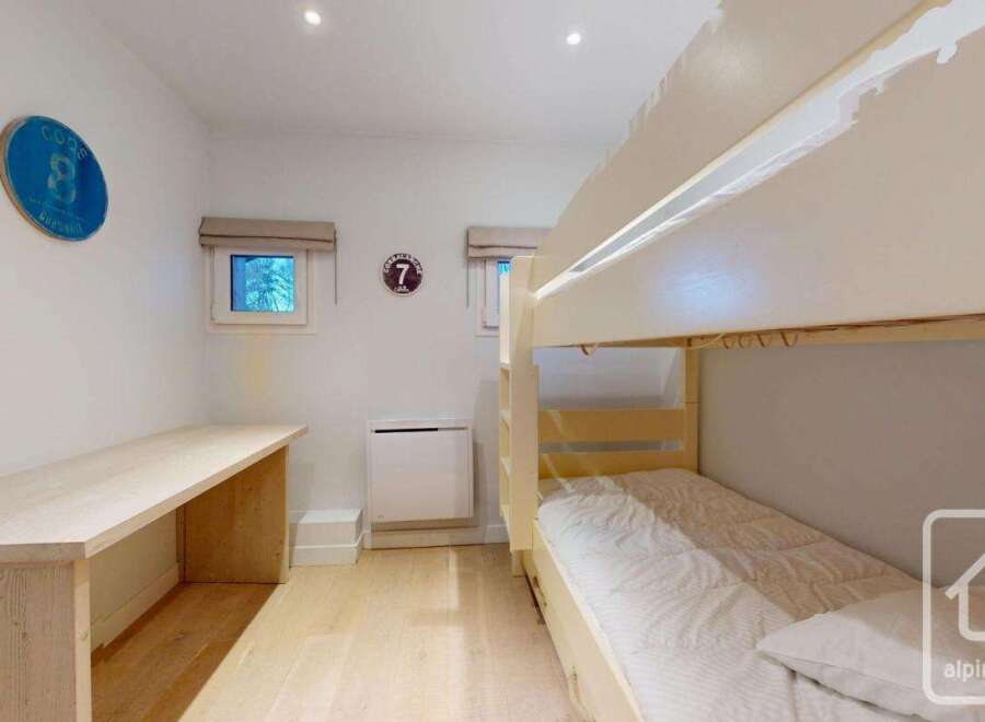This charming property features a cozy bunk bed setup, perfect for accommodating guests or family.