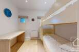 This charming property features a cozy bunk bed setup, perfect for accommodating guests or family.