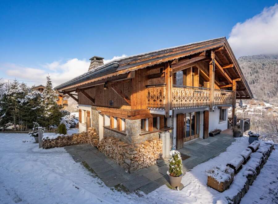 This stunning chalet boasts a beautiful wooden exterior and a cozy, inviting atmosphere.