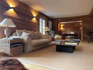 This stunning property boasts a warm and inviting living space, perfect for relaxation and entertaining.