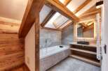 This stunning bathroom features a luxurious design with a modern touch.