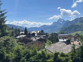 Nestled in a picturesque mountain village, this property offers stunning views of the surrounding peaks and lush greenery.