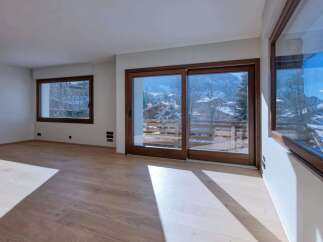 This stunning property boasts a bright and airy living space, perfect for enjoying the breathtaking mountain views.