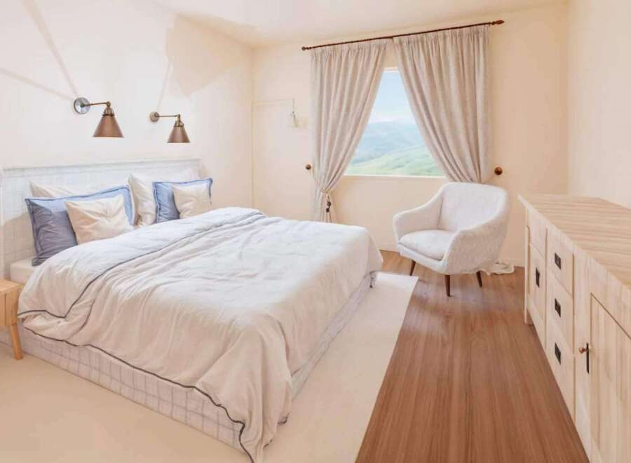 This inviting bedroom boasts a serene atmosphere, perfect for relaxation.