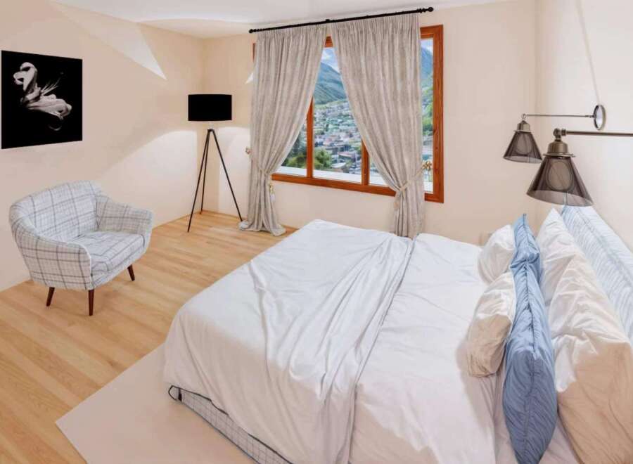 This stunning bedroom offers a serene retreat with its elegant design and inviting ambiance.