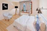 This stunning bedroom offers a serene retreat with its elegant design and inviting ambiance.