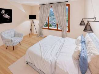 This stunning bedroom offers a serene retreat with its elegant design and inviting ambiance.