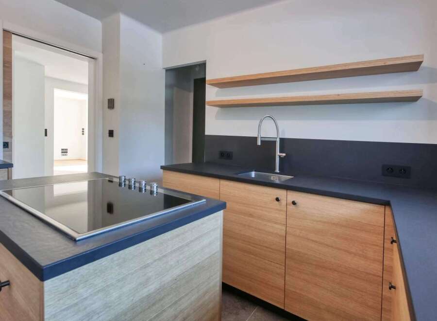 This modern kitchen boasts sleek design and functionality.