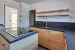 This modern kitchen boasts sleek design and functionality.
