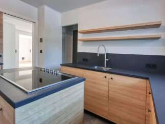 This modern kitchen boasts sleek design and functionality.