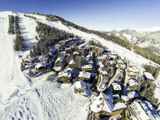 Nestled in a picturesque winter wonderland, this stunning property offers unparalleled luxury and breathtaking views.