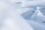 Experience the thrill of winter in this stunning mountain landscape.