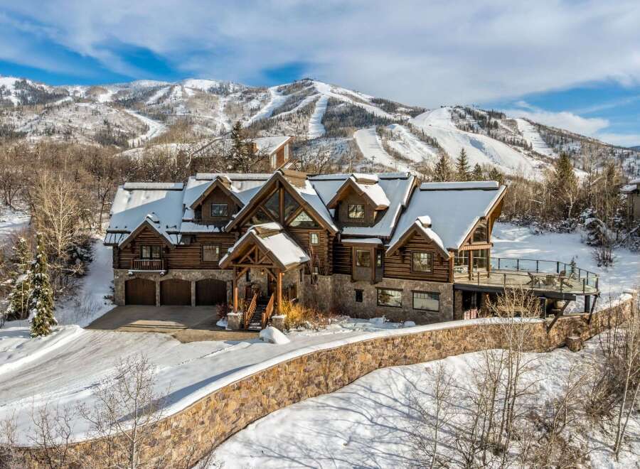 This stunning mountain home offers luxurious living with breathtaking views.