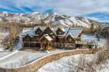 This stunning mountain home offers luxurious living with breathtaking views.