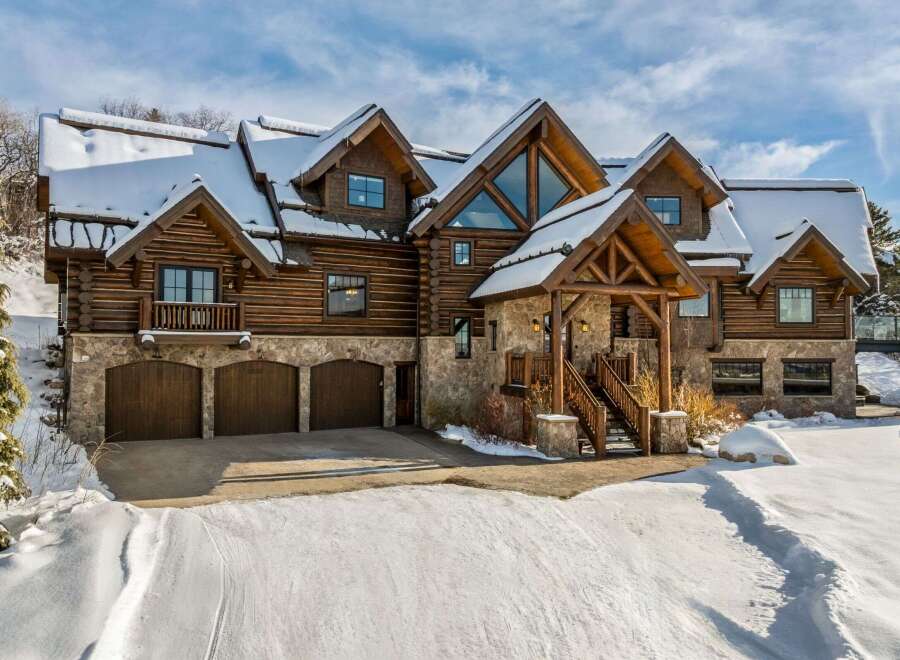 This stunning log cabin home offers a luxurious mountain living experience.